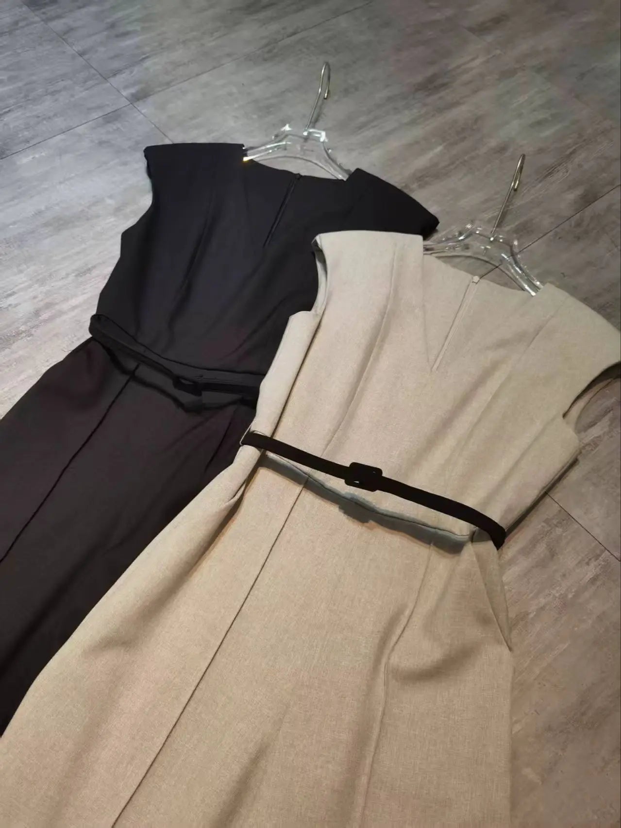 Elegant sleeveless trouser jumpsuit in a minimalist business style with belt