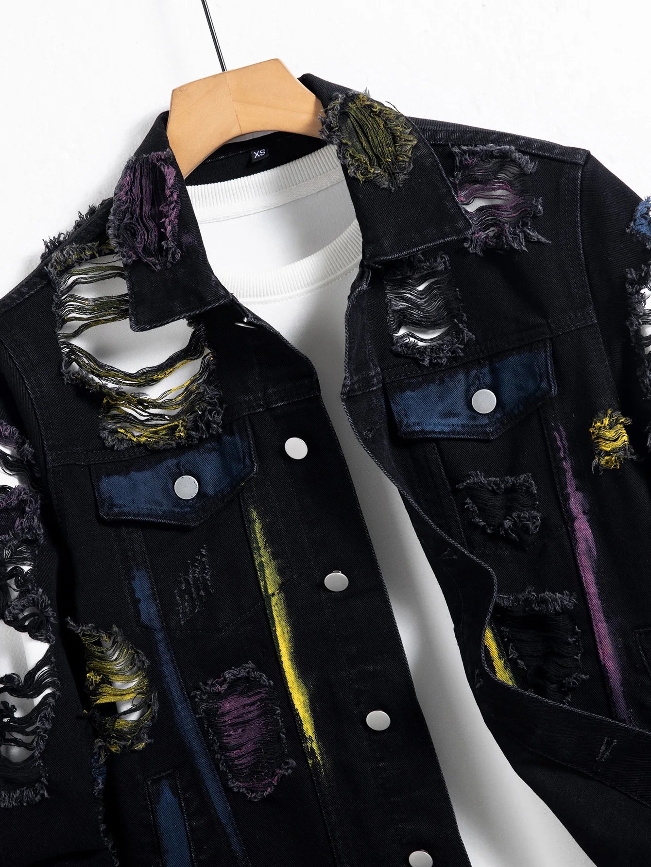 Men's black ripped denim jacket for spring and autumn. Random paint splashing.