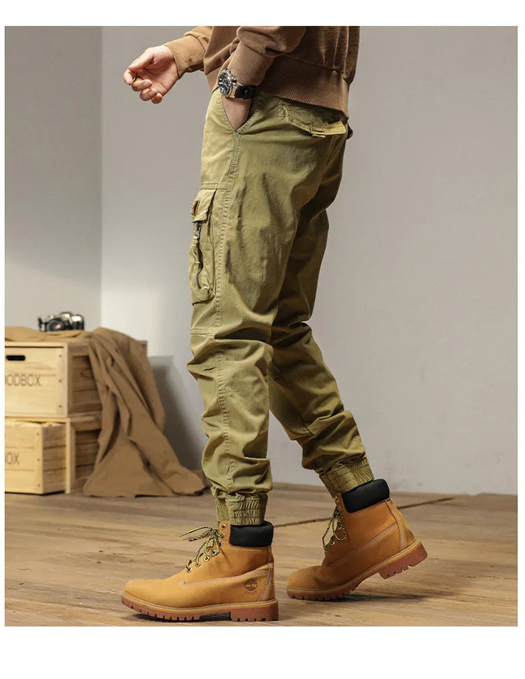 The new men's American retro sporty design in 2025 features multi-pocket, versatile drawstring work pants and stretch trousers