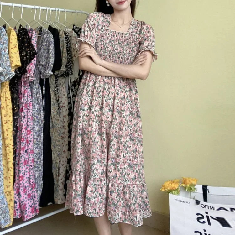 Women's pink floral chiffon midi dress with short sleeves, elastic waist, pleated A-line skirt