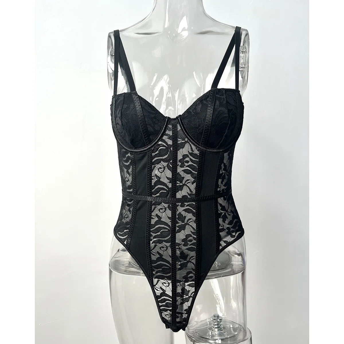 Black lace bodysuit with sheer floral panels and ribbed panels for a fitted silhouette