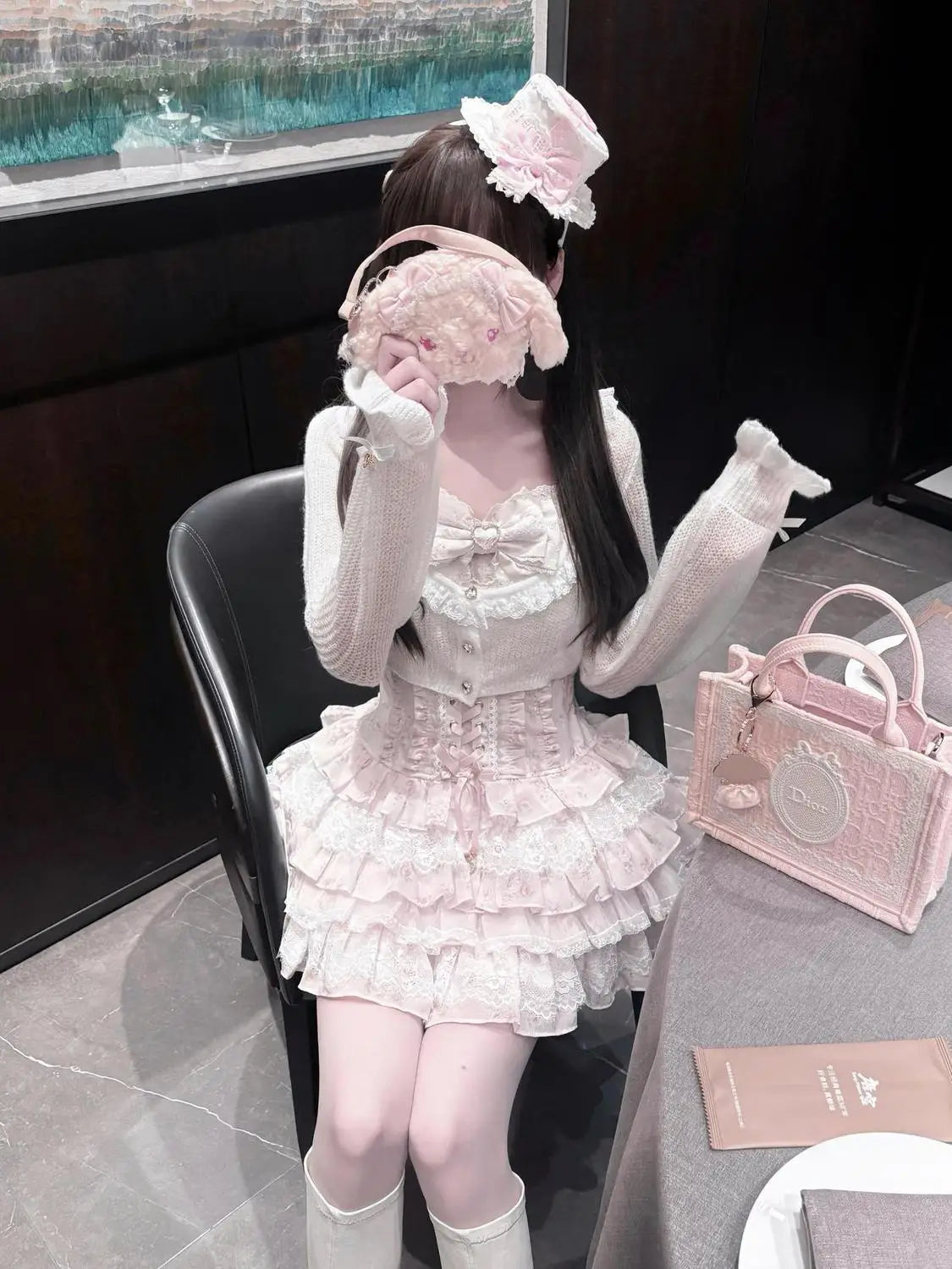 Japanese Sweet Lolita lace floral 2-piece pale pink set with bow and layered ruffle skirt; pink Dior handbag nearby.