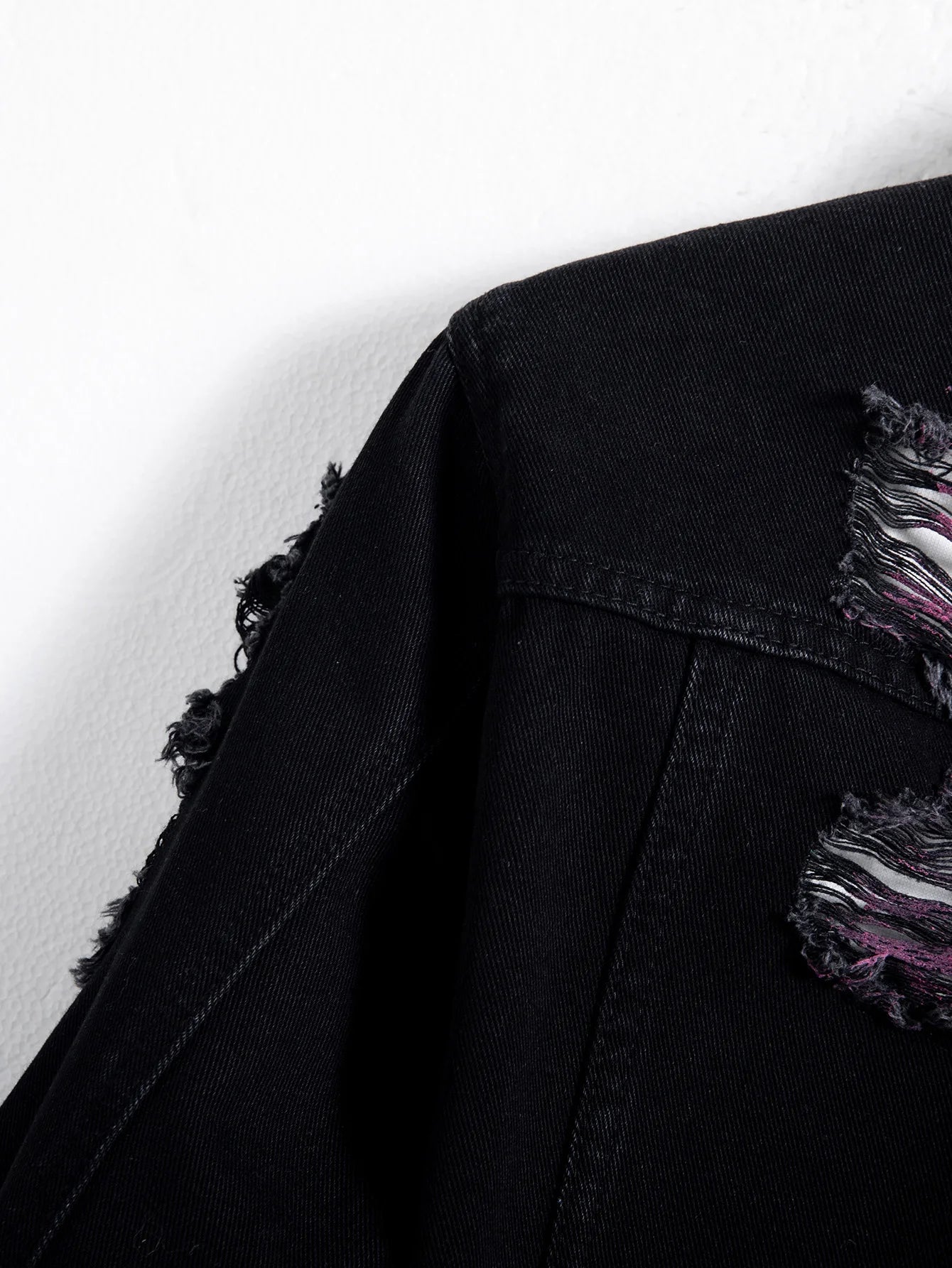 Men's black ripped denim jacket for spring and autumn. Random paint splashing.