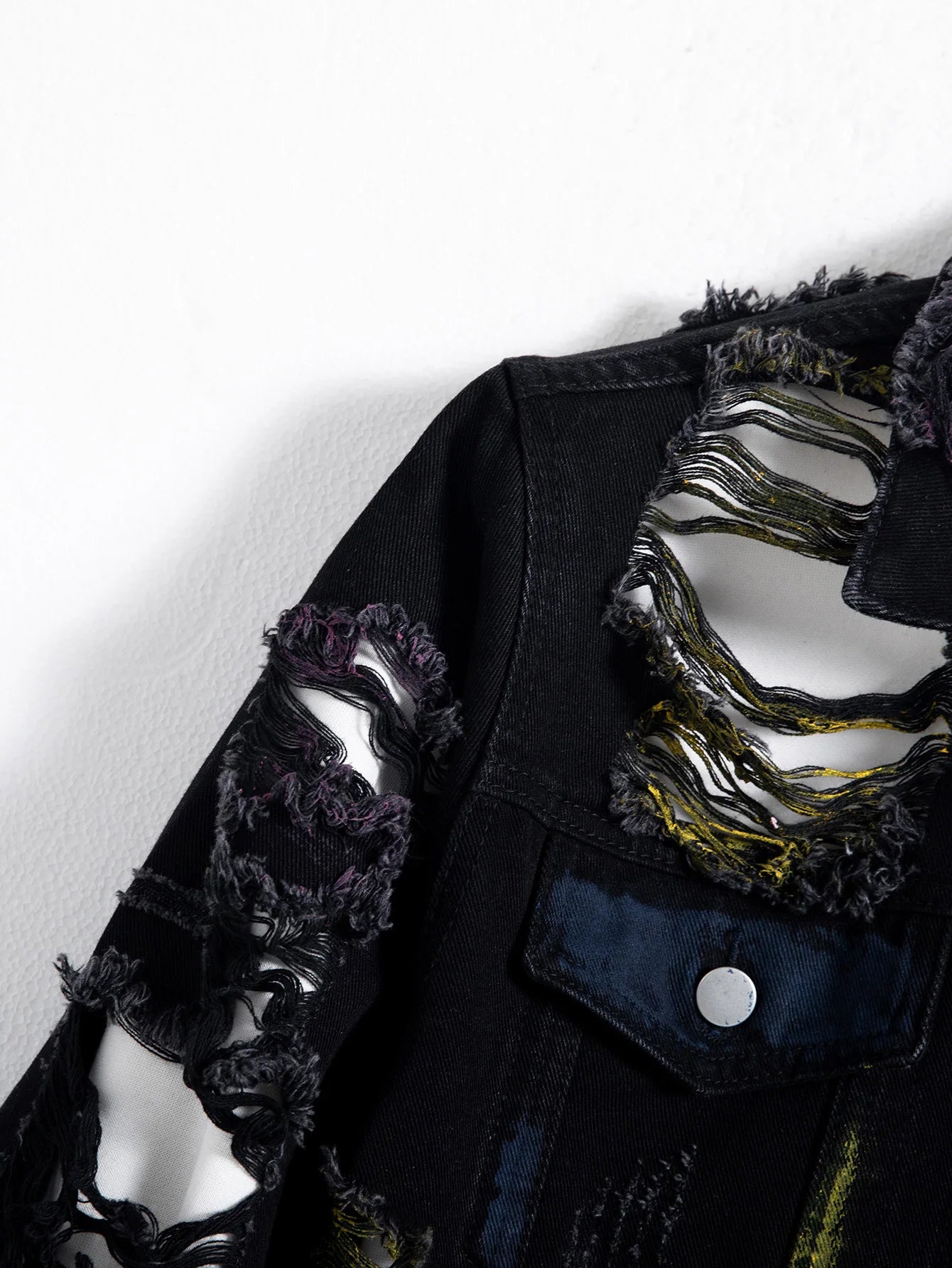 Men's black ripped denim jacket for spring and autumn. Random paint splashing.
