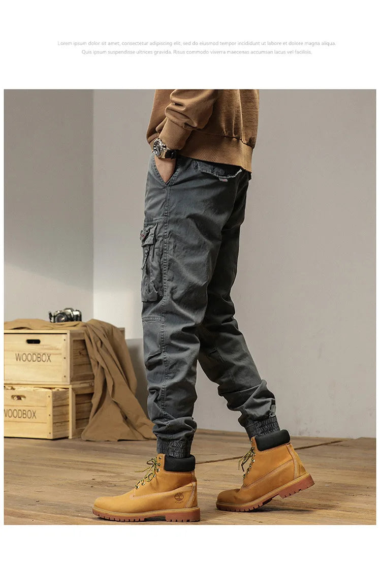 The new men's American retro sporty design in 2025 features multi-pocket, versatile drawstring work pants and stretch trousers