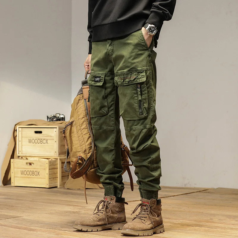 The new men's American retro sporty design in 2025 features multi-pocket, versatile drawstring work pants and stretch trousers