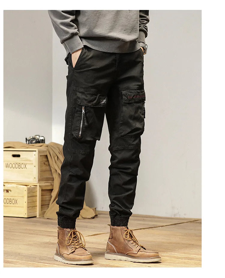 The new men's American retro sporty design in 2025 features multi-pocket, versatile drawstring work pants and stretch trousers