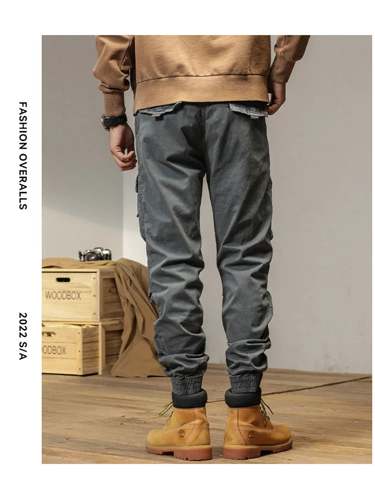 The new men's American retro sporty design in 2025 features multi-pocket, versatile drawstring work pants and stretch trousers