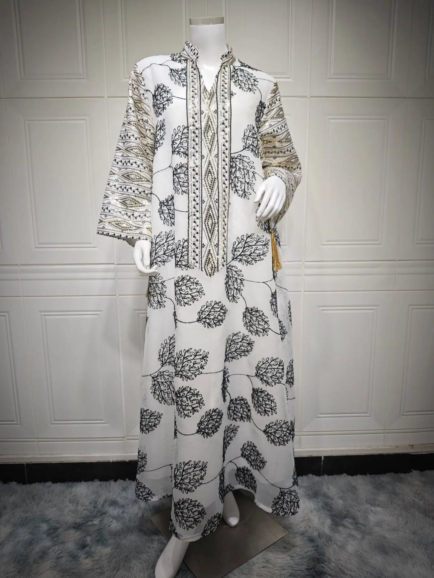 Elegant Light Green Abaya for Islamic Ladies Intricate Gold Embroidery and Tassel Accents Perfect for Festivities in Middle East