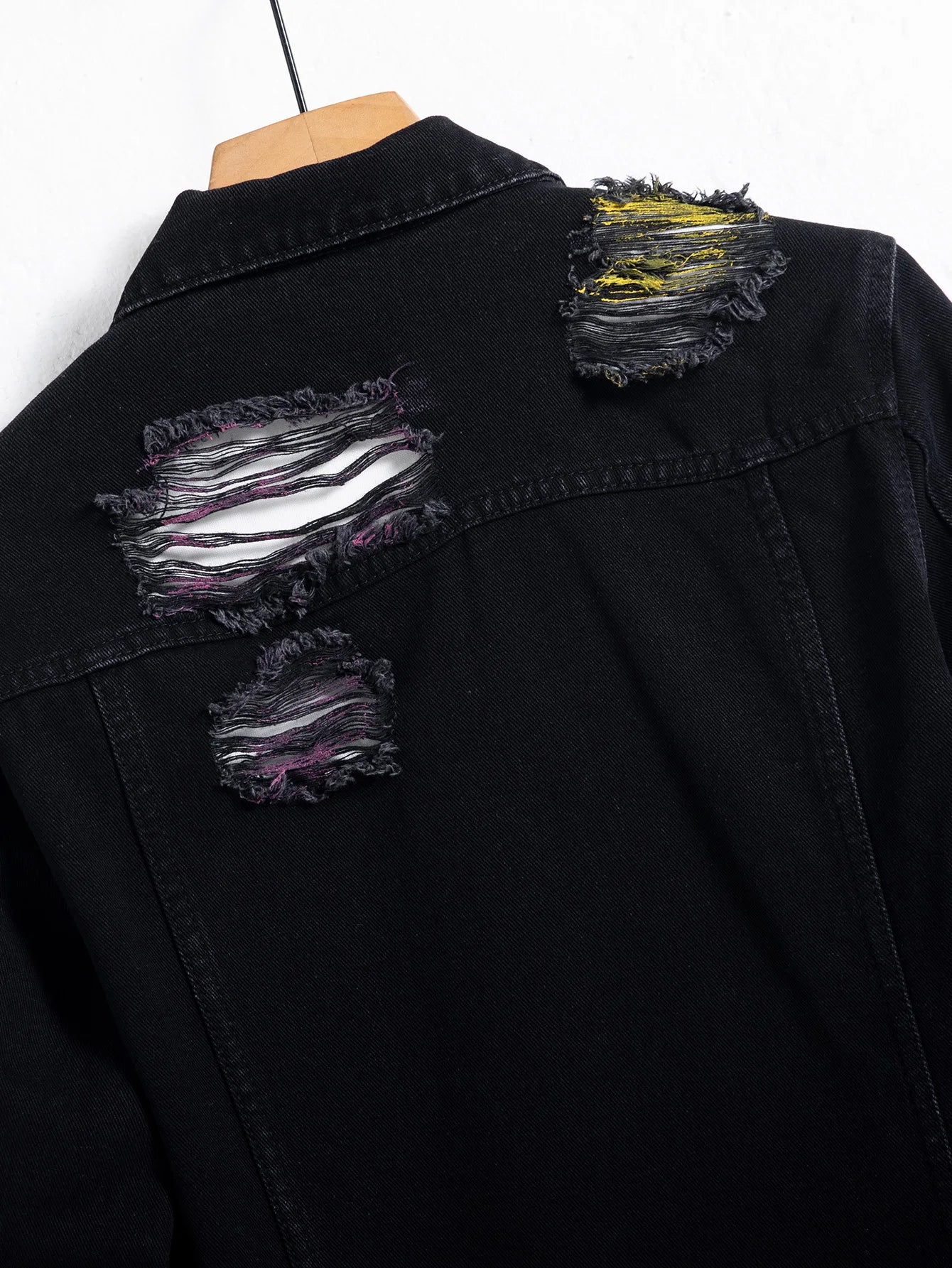 Men's black ripped denim jacket for spring and autumn. Random paint splashing.