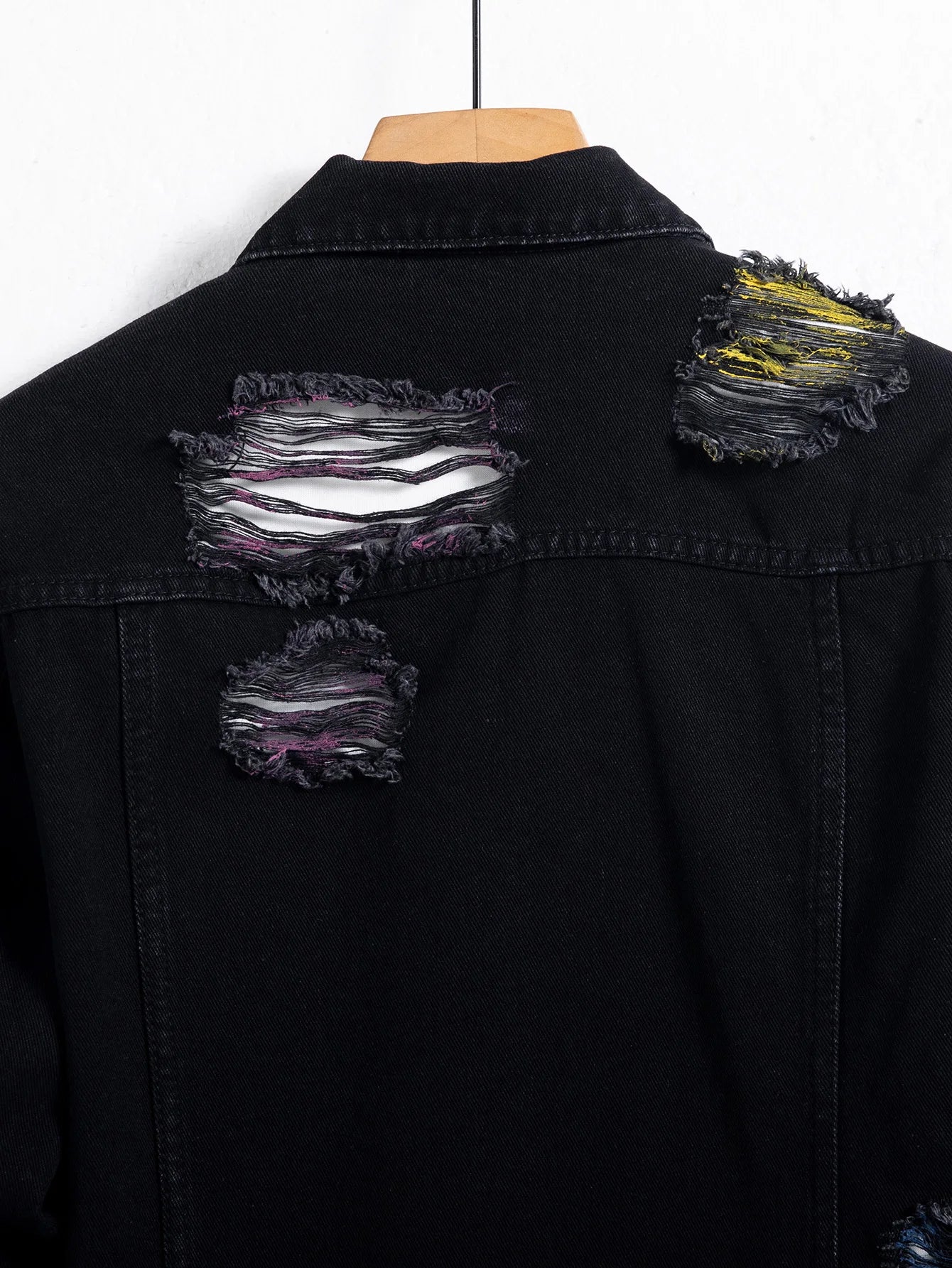 Men's black ripped denim jacket for spring and autumn. Random paint splashing.