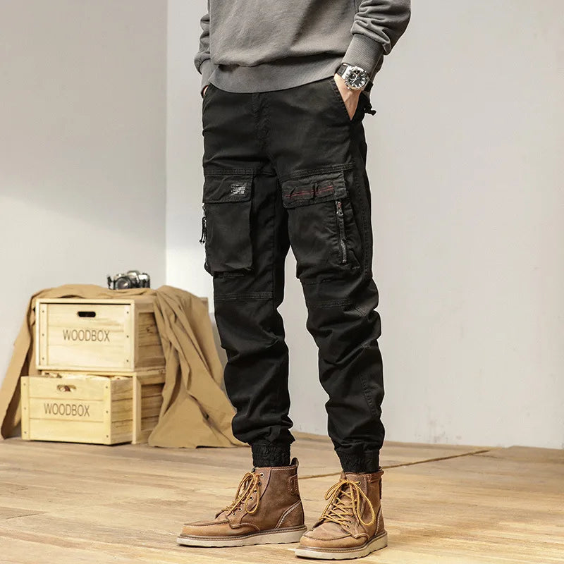 The new men's American retro sporty design in 2025 features multi-pocket, versatile drawstring work pants and stretch trousers