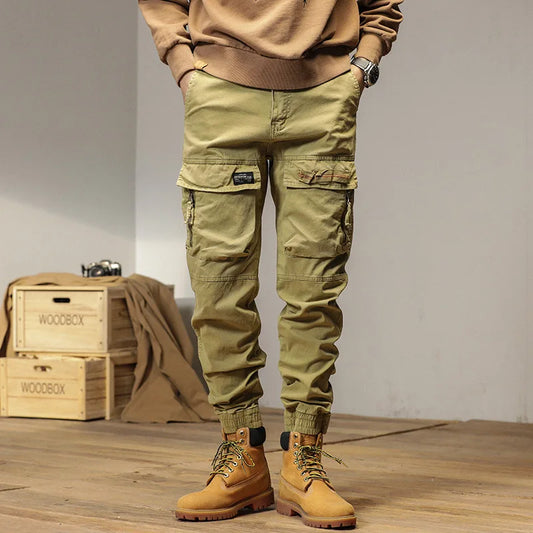 The new men's American retro sporty design in 2025 features multi-pocket, versatile drawstring work pants and stretch trousers