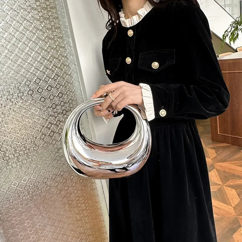 Hot Selling Creative Design Women's Top-Handle Bag PVC Metallic Luster Half Moon Banquet Women's Bag 2026 New Luxury Handbag