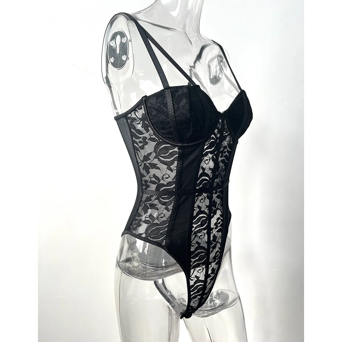 Black lace bodysuit with sheer floral panels and structured cups