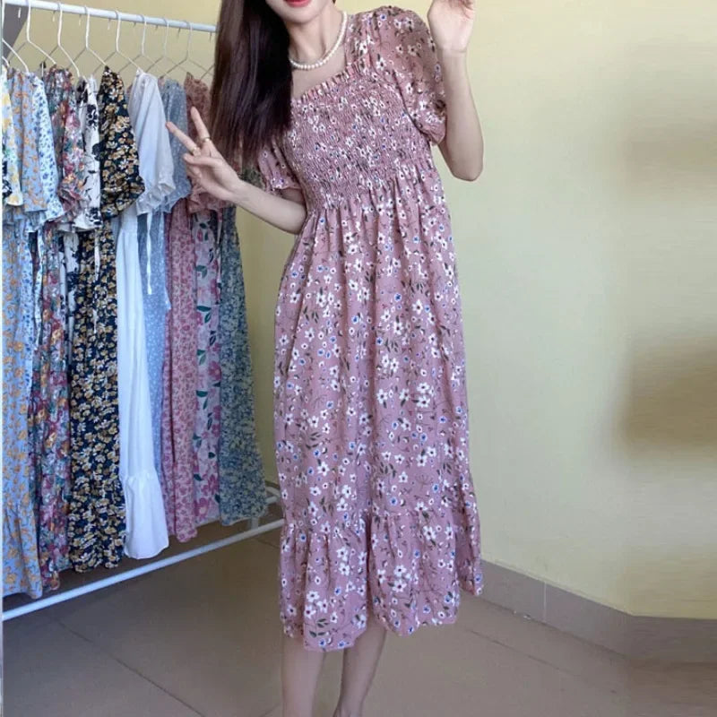 Women's pink floral chiffon dress with elastic waist, short sleeves, and A-line silhouette