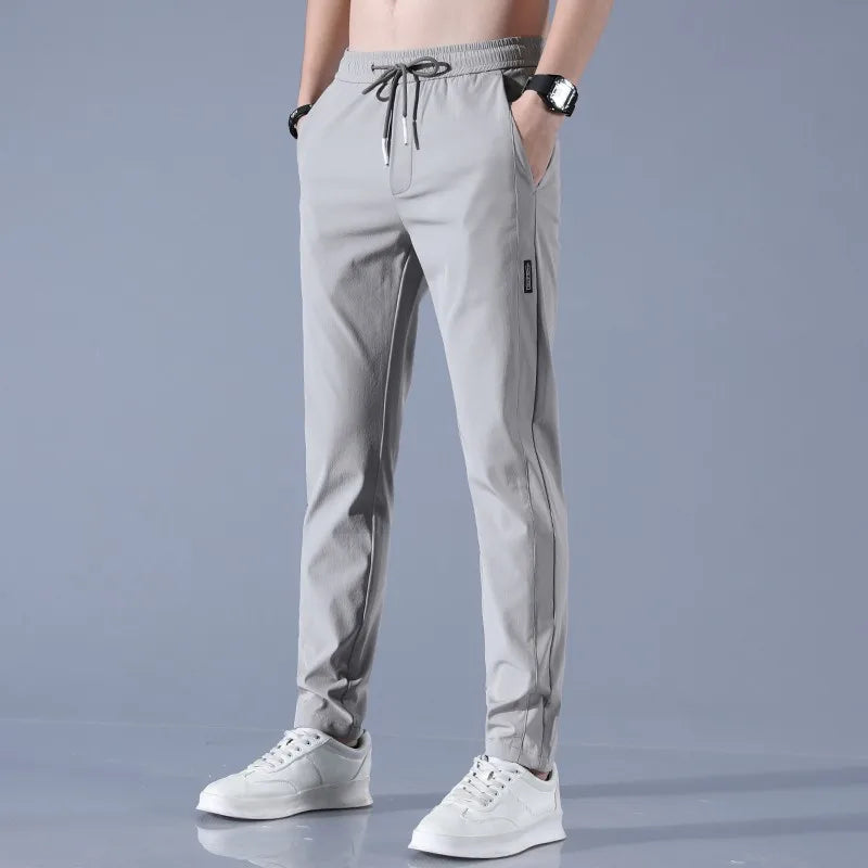 Pants Men 2024 Summer Ice Silk Casual Pants Men Straight Loose Elastic Thin Style Quick Dry Youth Sports Breathable Pants ﻿