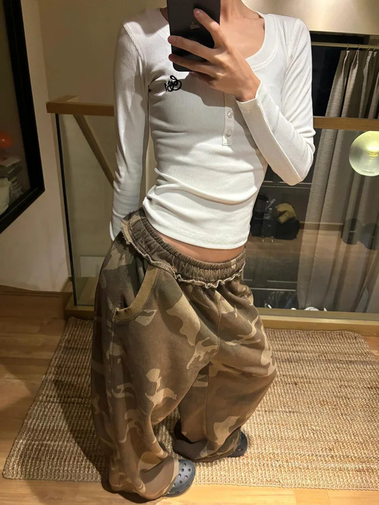 Camouflage cargo pants, loose-fit with elastic waistband and front pockets.