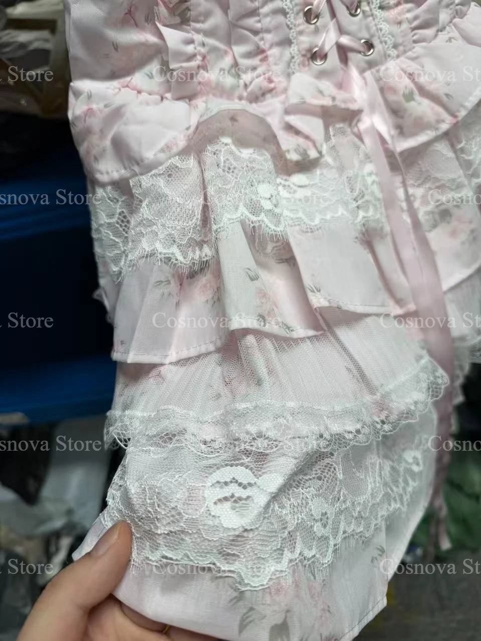 Pink floral lace Lolita 2-piece set with long-sleeve top, bow detail, and layered lace mini skirt