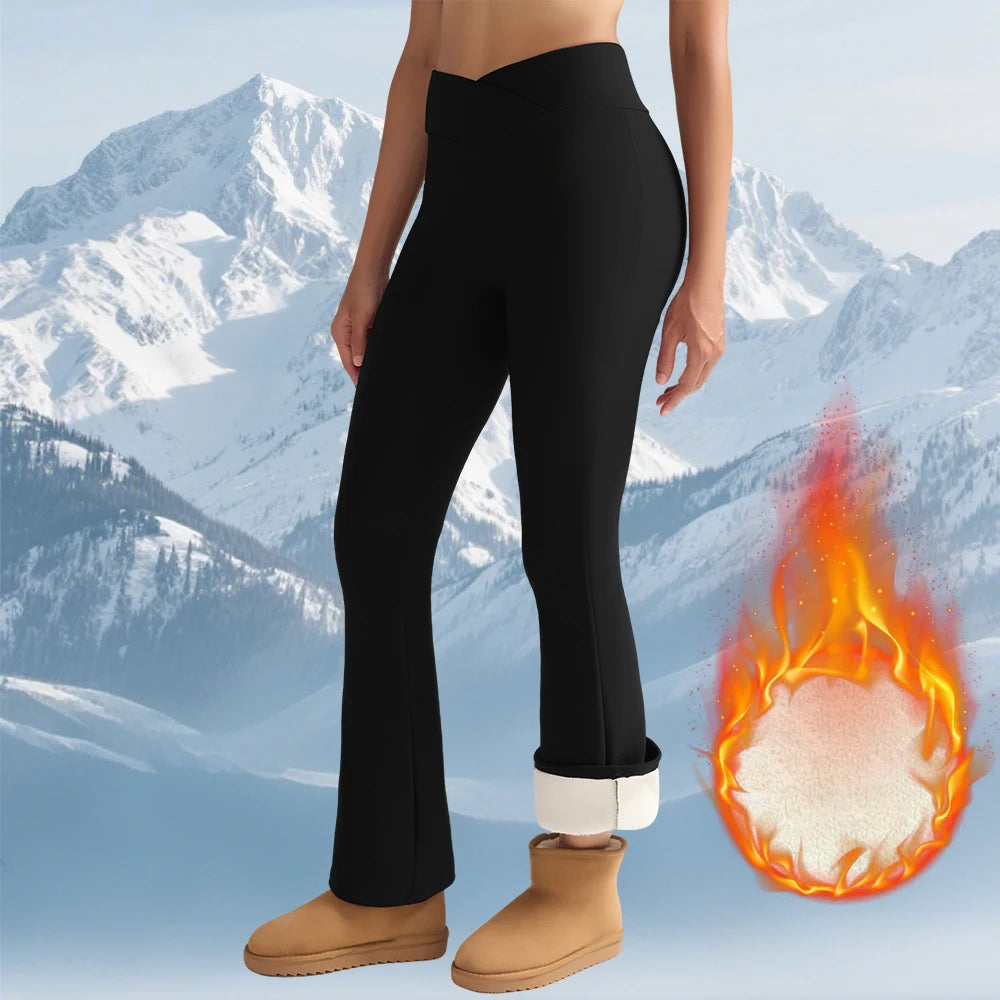 Fleece women’s high-waisted thermal flared leggings, black with white fleece-lined cuffs.