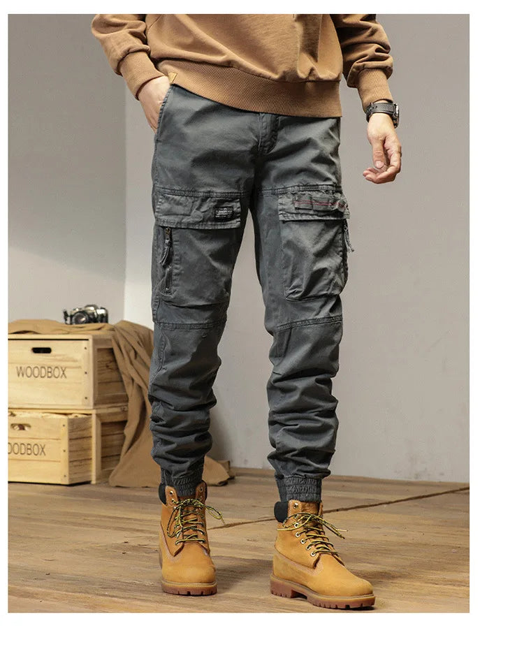 The new men's American retro sporty design in 2025 features multi-pocket, versatile drawstring work pants and stretch trousers