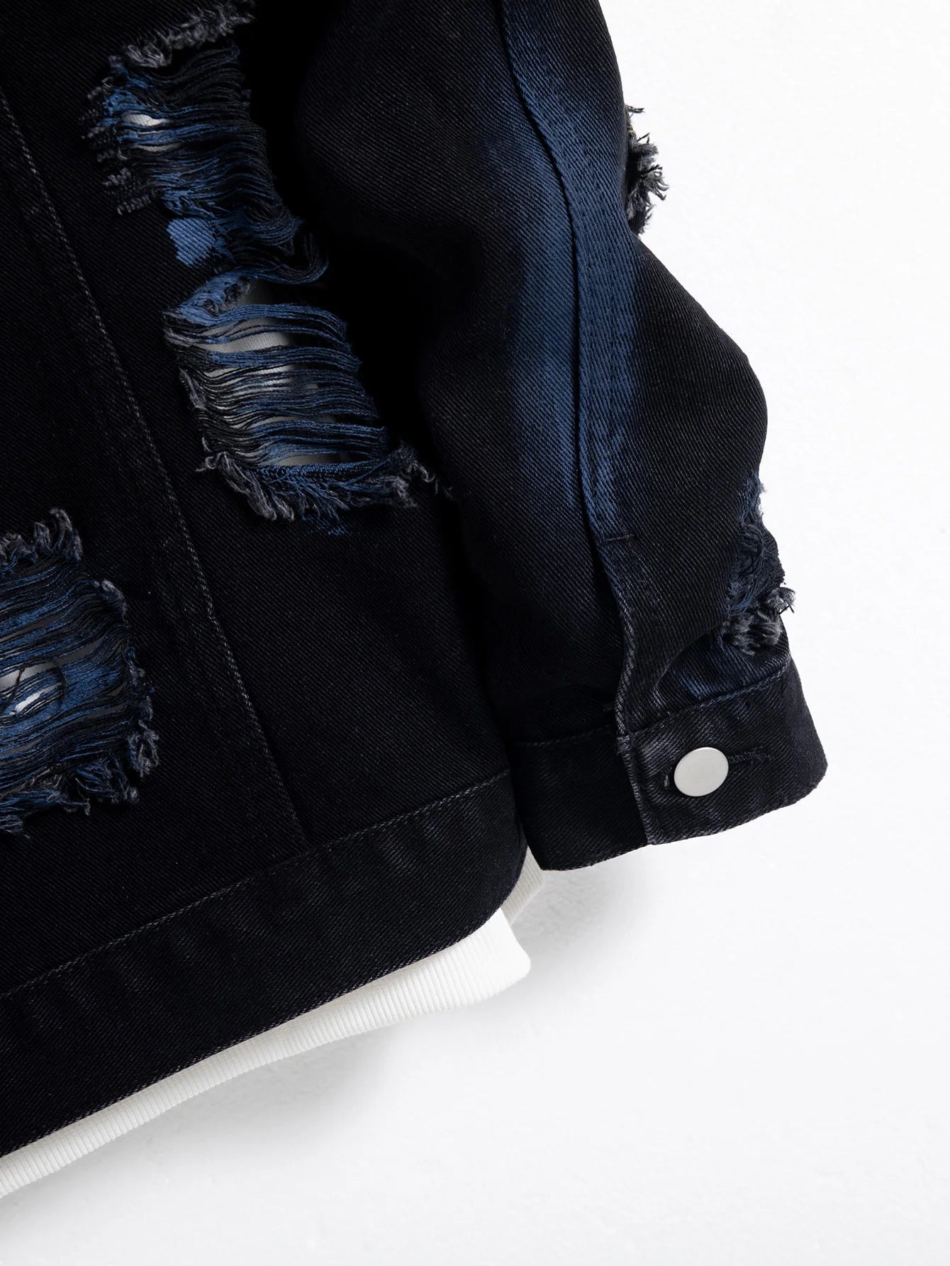 Men's black ripped denim jacket for spring and autumn. Random paint splashing.