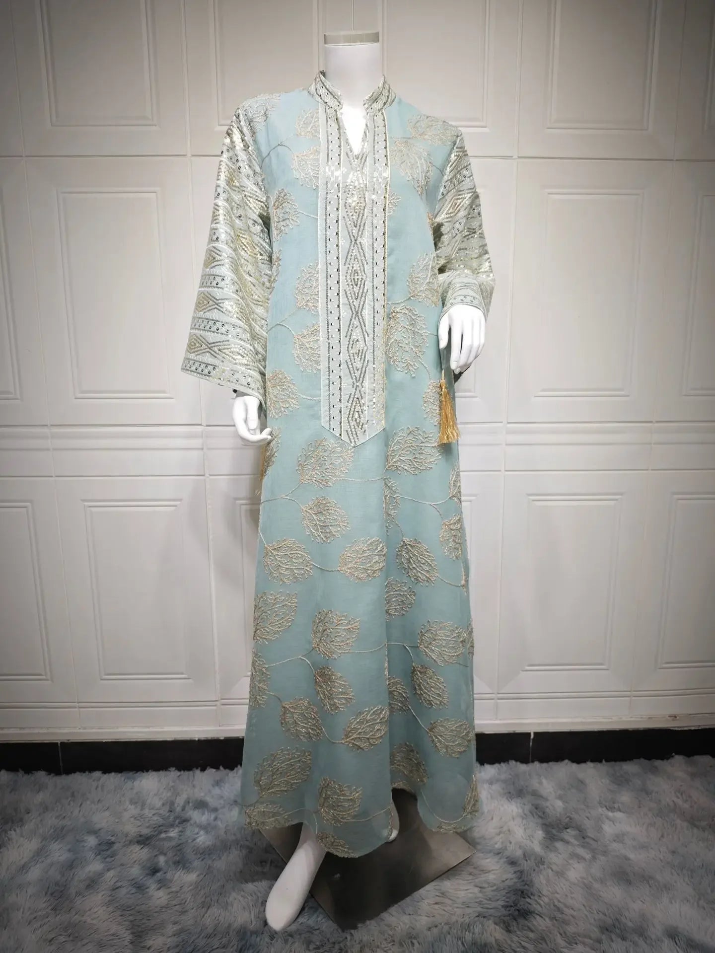 Elegant Light Green Abaya for Islamic Ladies Intricate Gold Embroidery and Tassel Accents Perfect for Festivities in Middle East